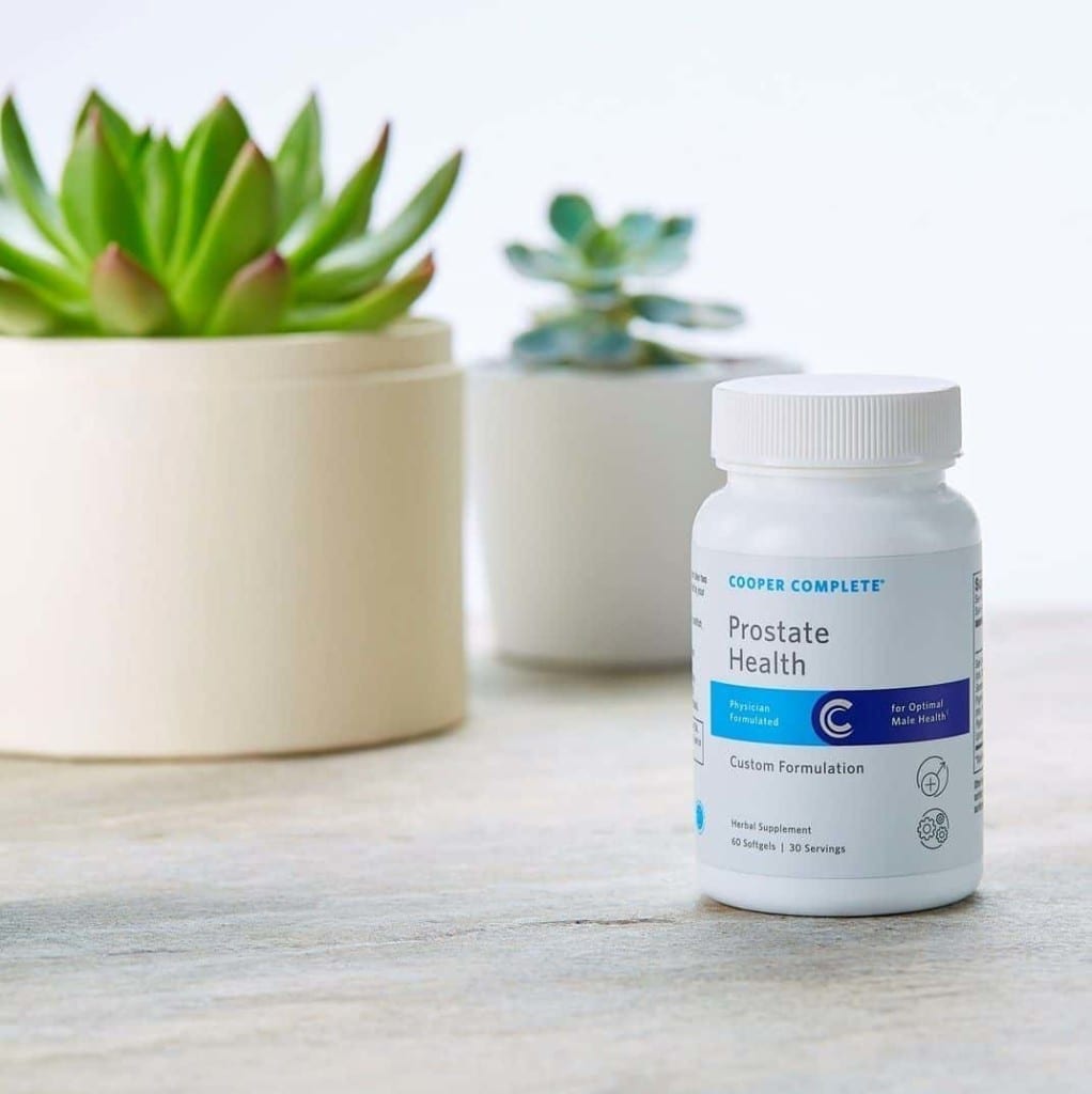 Cooper Complete Prostate Health Dietary Supplement with succulents behind