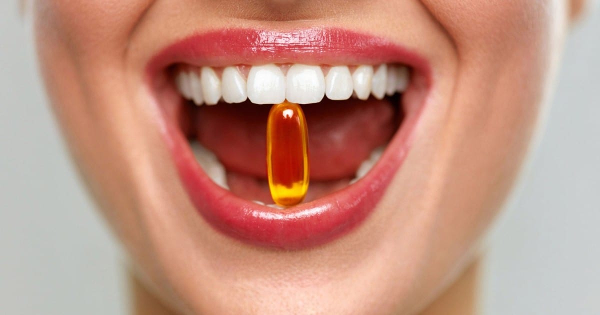 Women about to consume a supplement