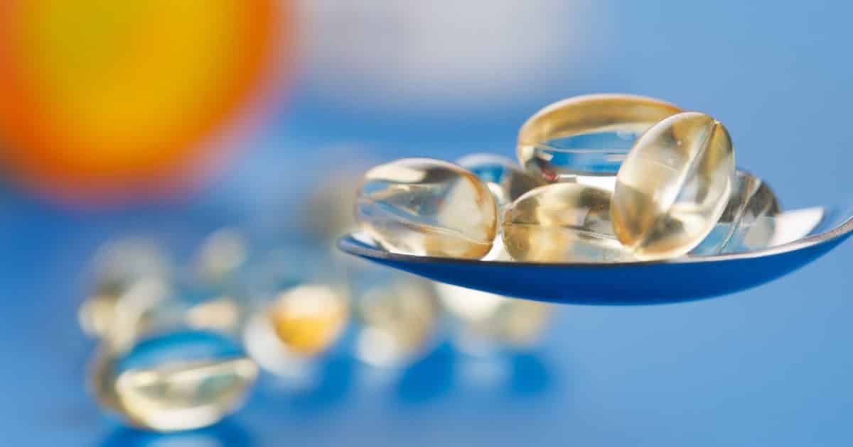 Supplements on a spoon ready to be taken and absorbed